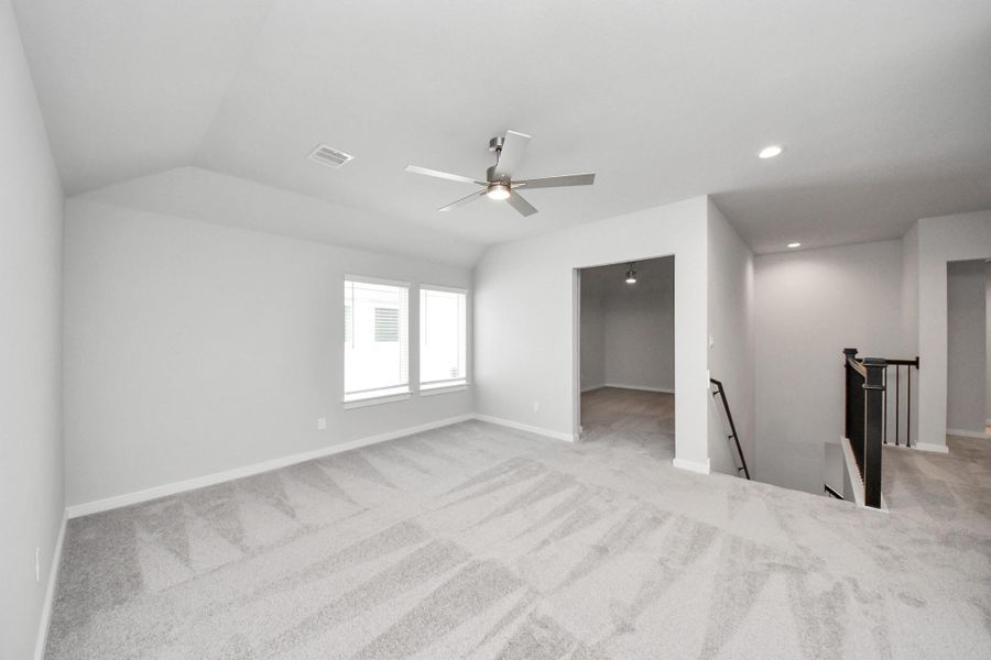 Come upstairs and enjoy a day of leisure in this fabulous game room! This is the perfect hangout spot or adult game room! Features plush carpet, high ceilings, custom paint and windows for plenty of natural light.