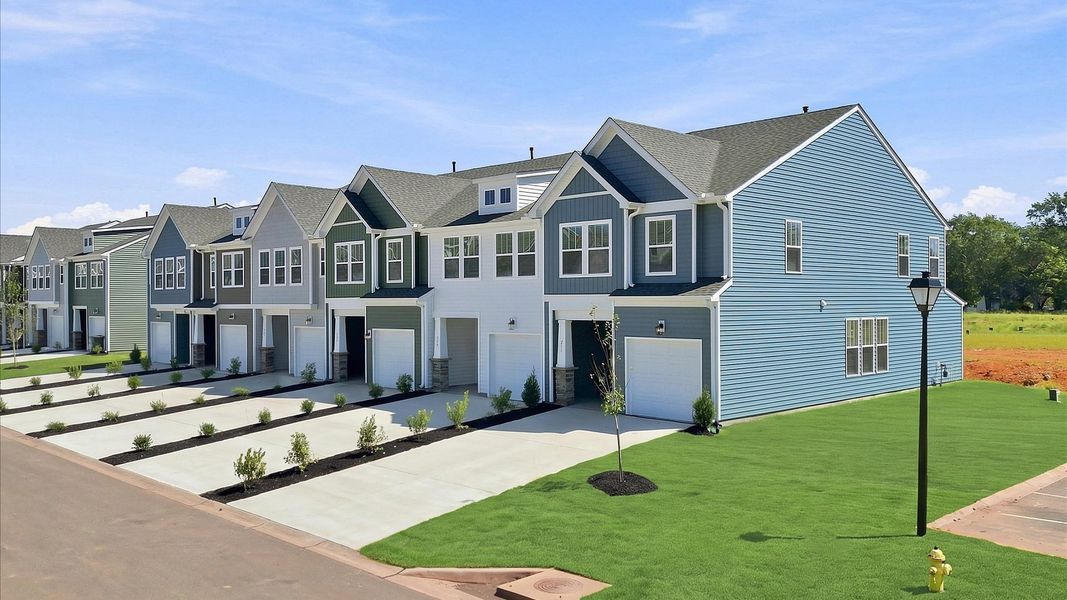 Refined exterior design with balanced architectural detail in this distinguished two-story villa in Piedmont, SC Refined exterior design with balanced architectural detail in this distinguished two-story villa in Piedmont, SC