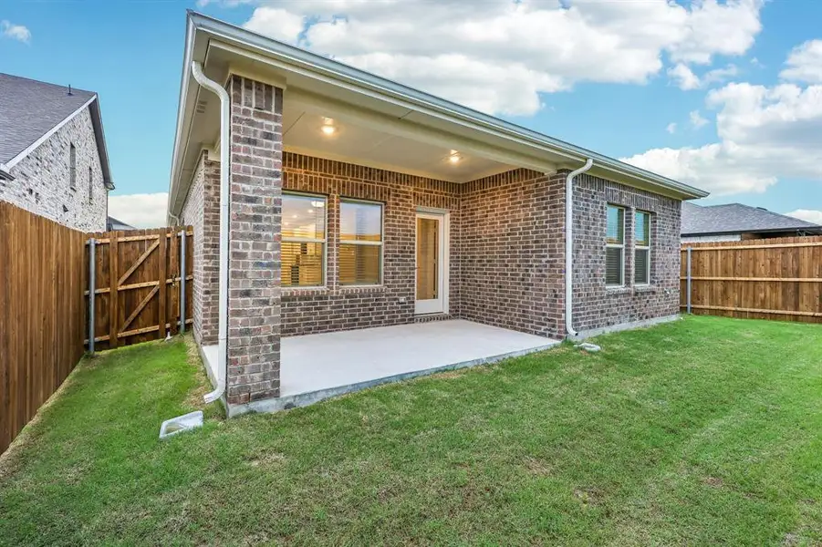 Exterior details and patio area of a home in Parks at Foster Crossing - Spring Series, Anna (Image 3).