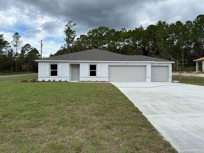 Front exterior of a new home in Citrus Springs, Citrus Springs, FL, highlighting curb appeal (Image 1).