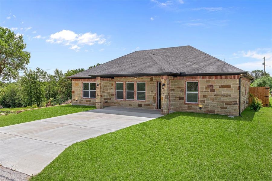 Front exterior of a new home in , Granbury, TX, highlighting curb appeal (Image 23).