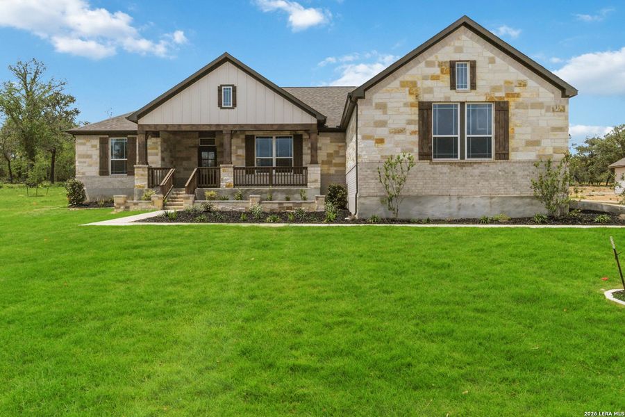 Front exterior of a new home in Jordan's Ranch, San Antonio, TX, highlighting curb appeal (Image 23).