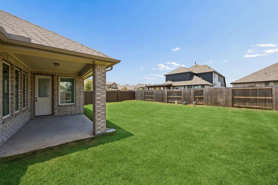 Exterior details and patio area of a home in Brookewater, Rosenberg (Image 4).