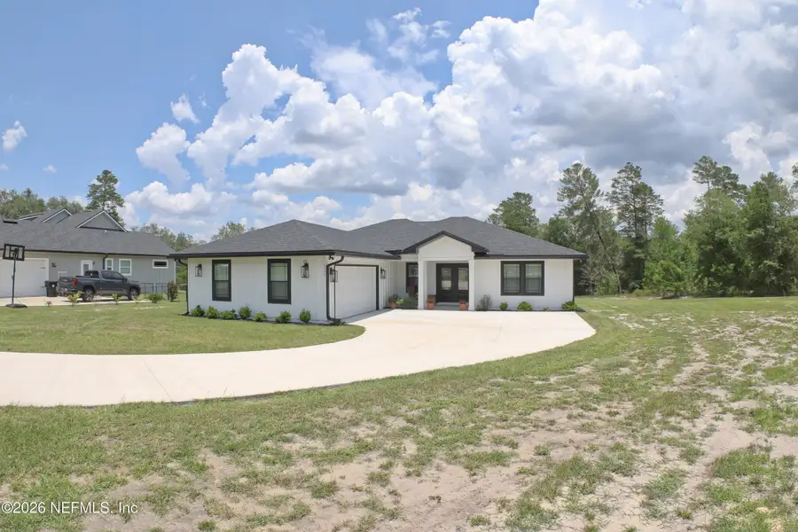Front exterior of a new home in , Keystone Heights, FL, highlighting curb appeal (Image 1). Front exterior of a new home in , Keystone Heights, FL, highlighting curb appeal (Image 1).