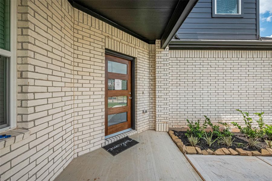 Exterior details and patio area of a home in Sunterra, Katy (Image 3).