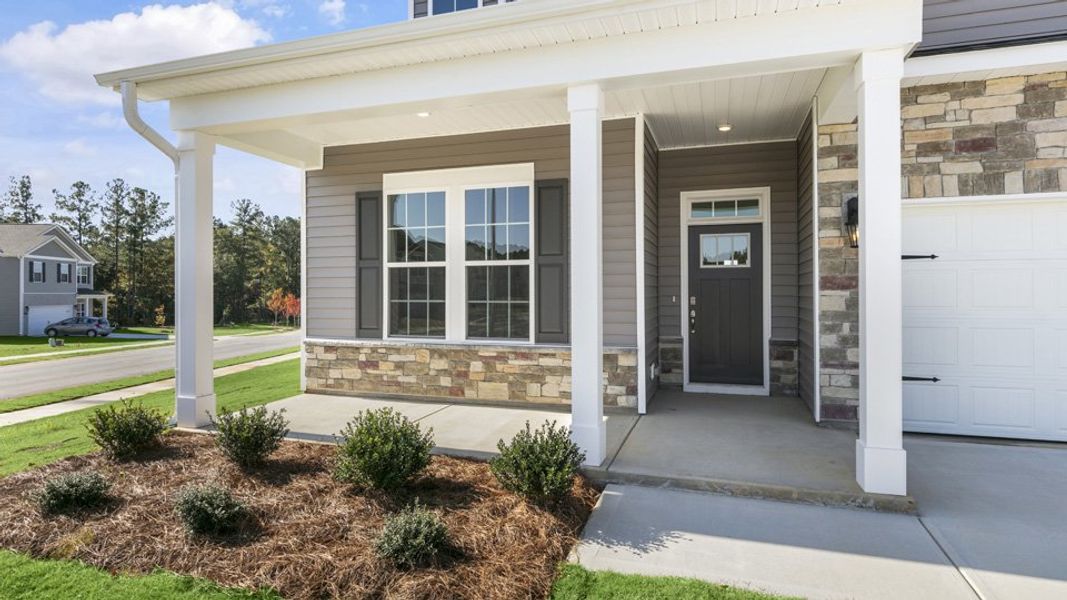 Exterior details and patio area of a home in The Villas at Martin Farms, Aberdeen (Image 3).