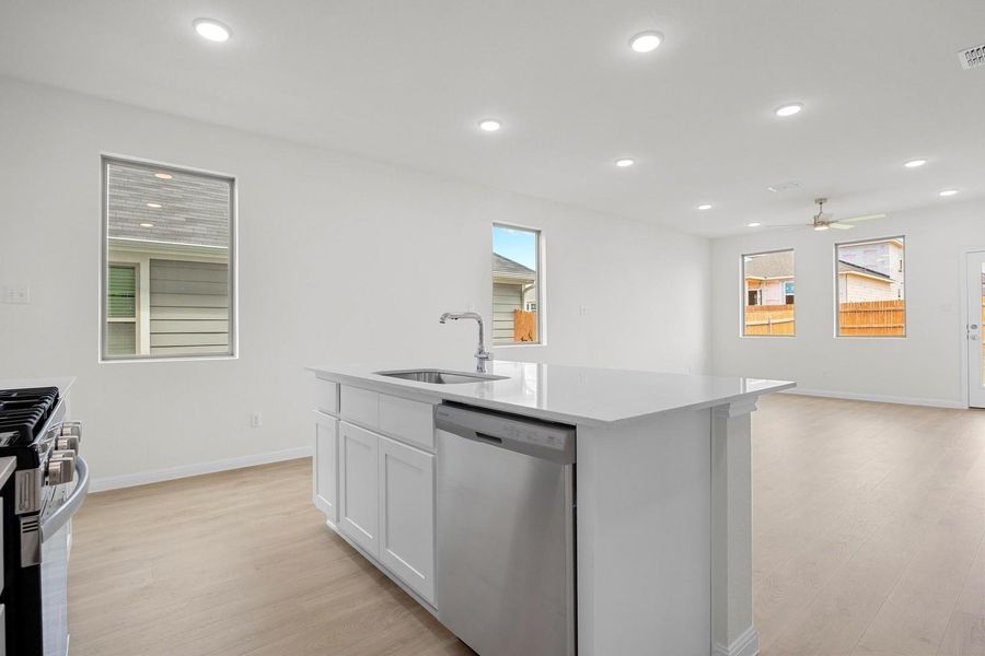 Kitchen in the Magnolia home plan by Trophy Signature Homes – REPRESENTATIVE PHOTO