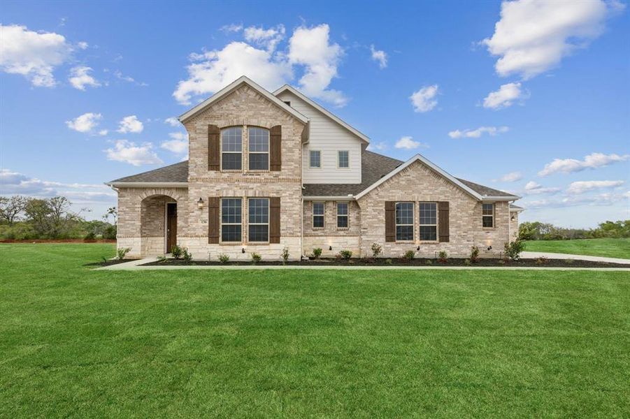 View of front facade featuring brick siding, a shingled roof, and a front lawn View of front facade featuring brick siding, a shingled roof, and a front lawn
