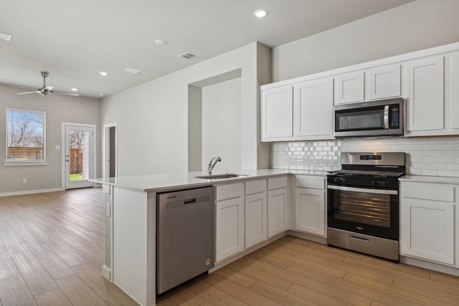 Kitchen in the Birch home plan by Trophy Signature Homes – REPRESENTATIVE PHOTO