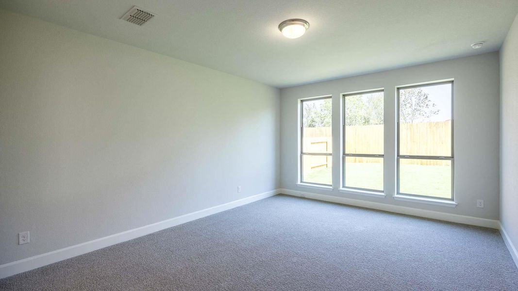 Spare room with carpet and baseboards Spare room with carpet and baseboards