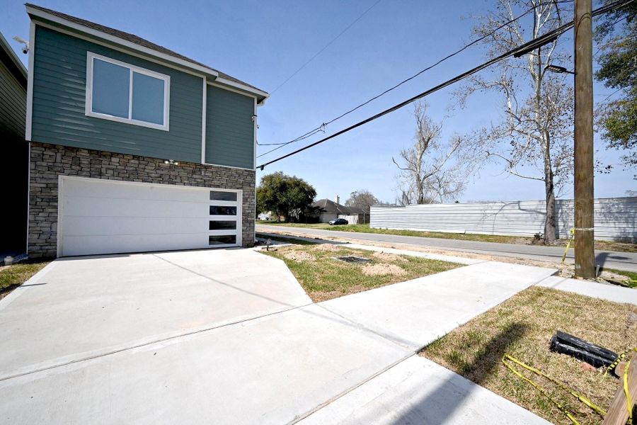 Front exterior of a new home in , Houston, TX, highlighting curb appeal (Image 1). Front exterior of a new home in , Houston, TX, highlighting curb appeal (Image 1).