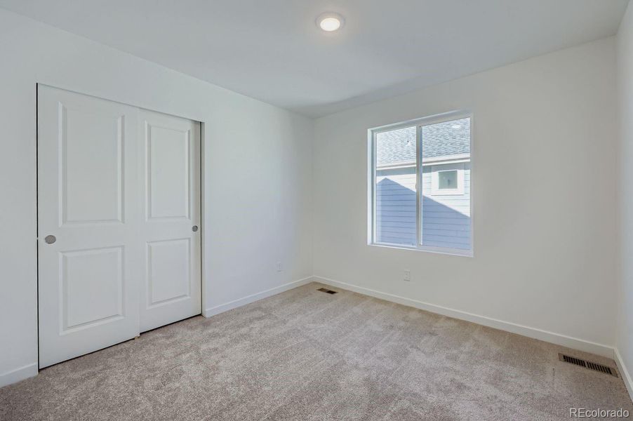 Spacious, unfurnished interior of a new home in Percheron: The Explorer Collection, Colorado Springs (Image 6).