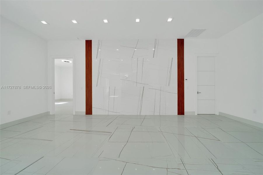 ENTERTAINMENT AREA WATERFALL OF TILE WITH MAHOGANY ACOUSTIC PANEL ENTERTAINMENT AREA WATERFALL OF TILE WITH MAHOGANY ACOUSTIC PANEL