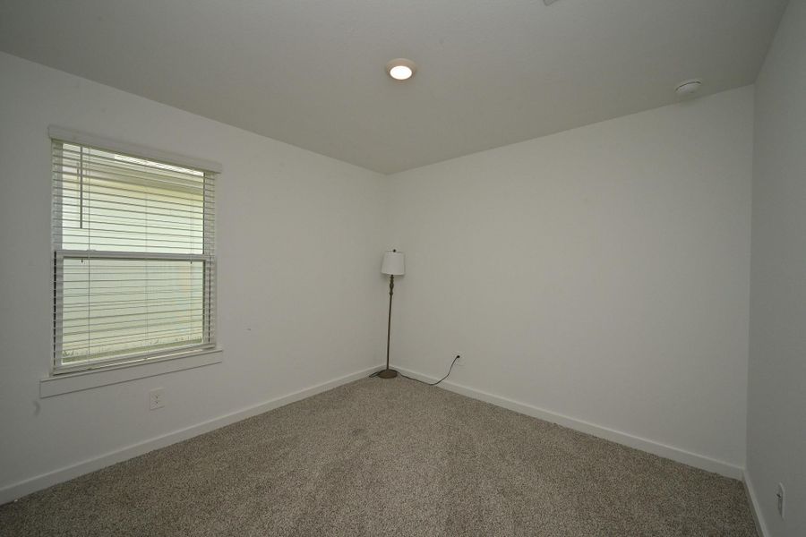 The 3rd bedroom features neutral carpeting, a single window with blinds. It's well-lit with a ceiling light. Offering a versatile space ideal for an office or bedroom. The 3rd bedroom features neutral carpeting, a single window with blinds. It's well-lit with a ceiling light. Offering a versatile space ideal for an office or bedroom.