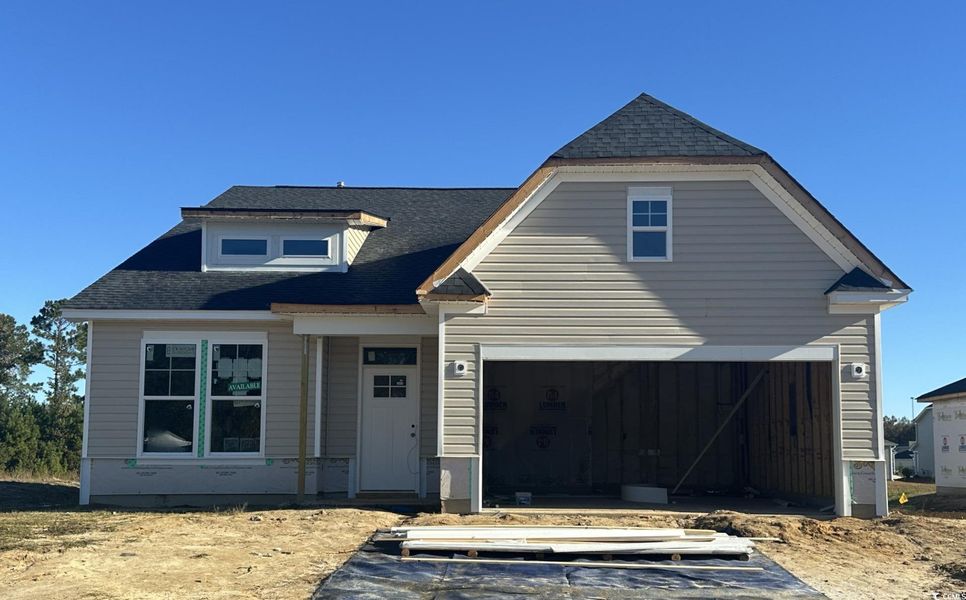 View of front facade with roof with shingles