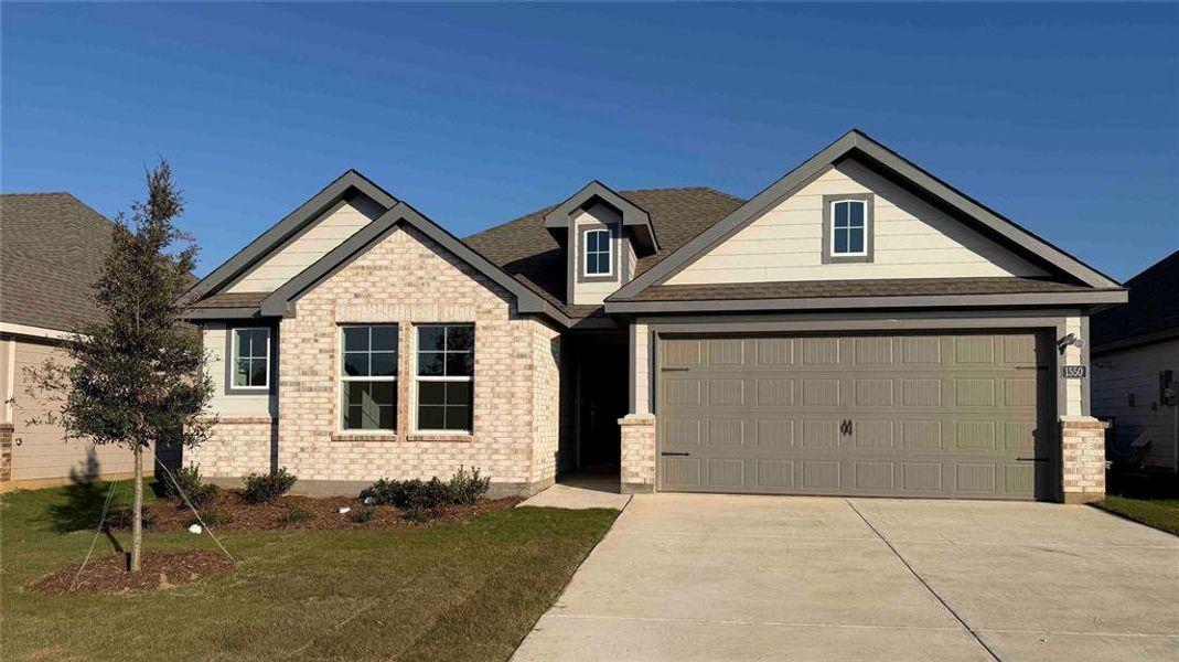 Front exterior of a new home in Blaire Lake, Tyler, TX, highlighting curb appeal (Image 2). Front exterior of a new home in Blaire Lake, Tyler, TX, highlighting curb appeal (Image 2).