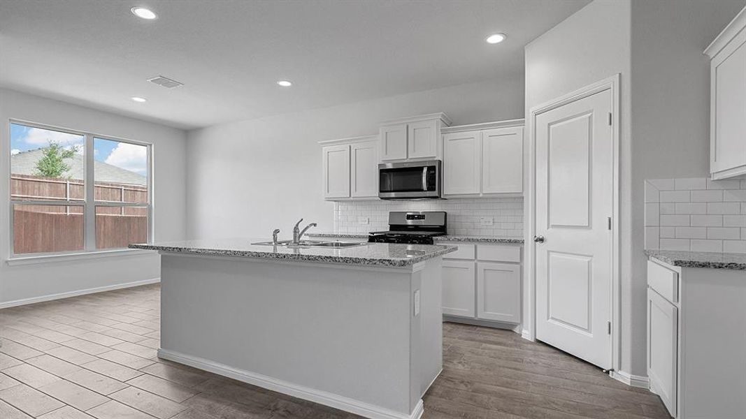 Kitchen - All Home and community information, including pricing, included features, terms, availability and amenities, are subject to change at any time without notice or obligation. All Drawings, pictures, photographs, video, square footages, floor plans, elevations, features, colors and sizes are approximate for illustration purposes only and will vary from the homes as built.