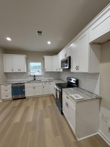 Furnished interior view inside a new home in , Santee (Image 3). Furnished interior view inside a new home in , Santee (Image 3).