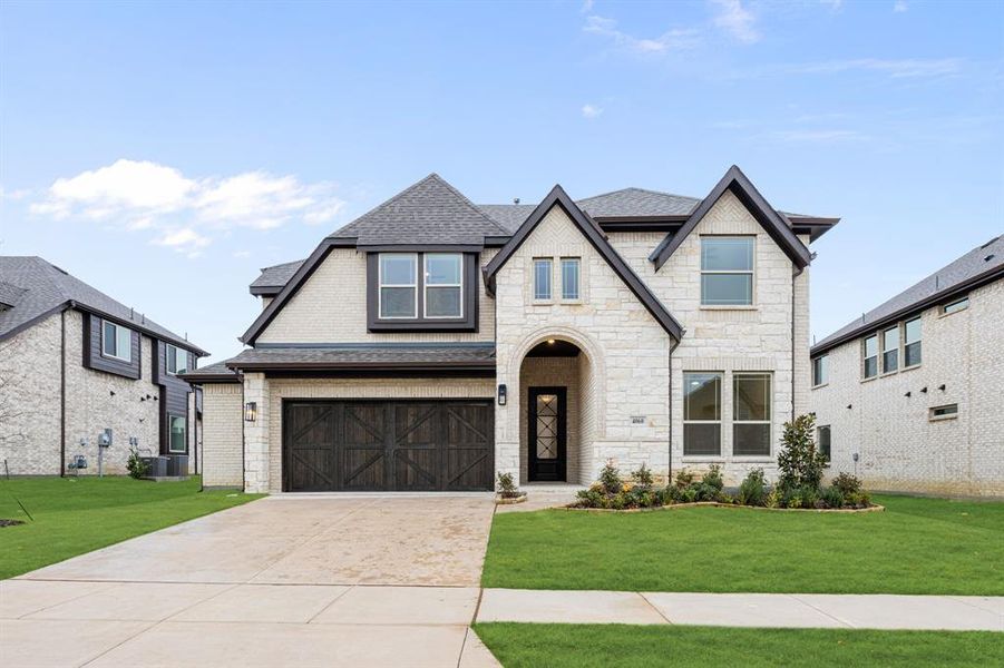 Front exterior of a new home in Windsong Ranch Classic 61, Prosper, TX, highlighting curb appeal (Image 1). Front exterior of a new home in Windsong Ranch Classic 61, Prosper, TX, highlighting curb appeal (Image 1).