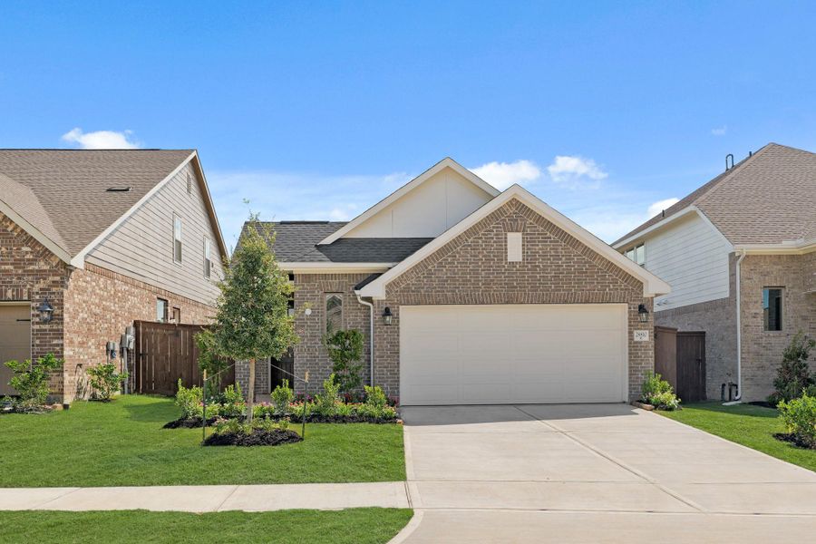 Front exterior of a new home in The Trails, New Caney, TX, highlighting curb appeal (Image 2). Front exterior of a new home in The Trails, New Caney, TX, highlighting curb appeal (Image 2).