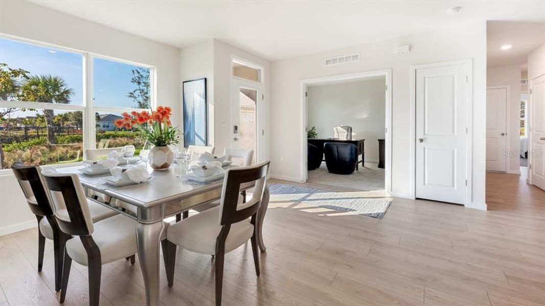 Furnished interior view inside a new home in Cove at West Port - Express, Port Charlotte (Image 11).