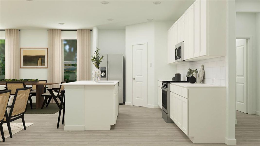 Kitchen featuring stainless steel appliances, tasteful backsplash, a breakfast bar area, a kitchen island with sink, and white cabinets