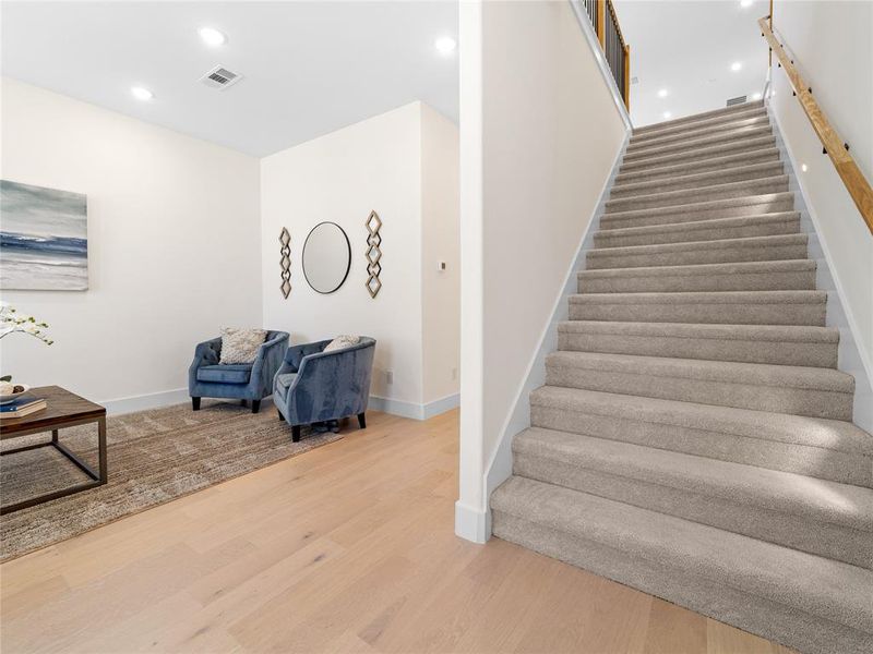 Stairway featuring recessed lighting and wood finished floors