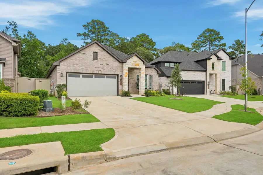 Front exterior of a new home in Audubon, Magnolia, TX, highlighting curb appeal (Image 20).