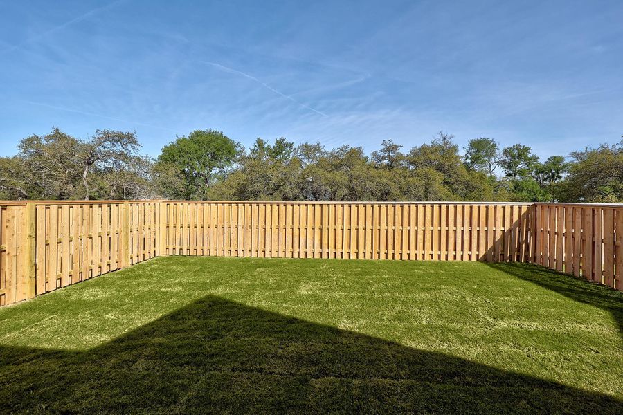 Exterior details and patio area of a home in Parmer Ranch, Georgetown (Image 21).