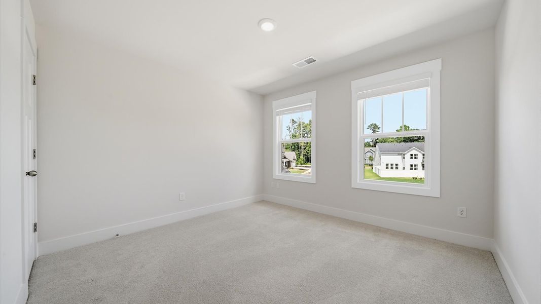 First-class bedroom with generous proportions, a walk-in closet, and beautiful natural light through large windows First-class bedroom with generous proportions, a walk-in closet, and beautiful natural light through large windows