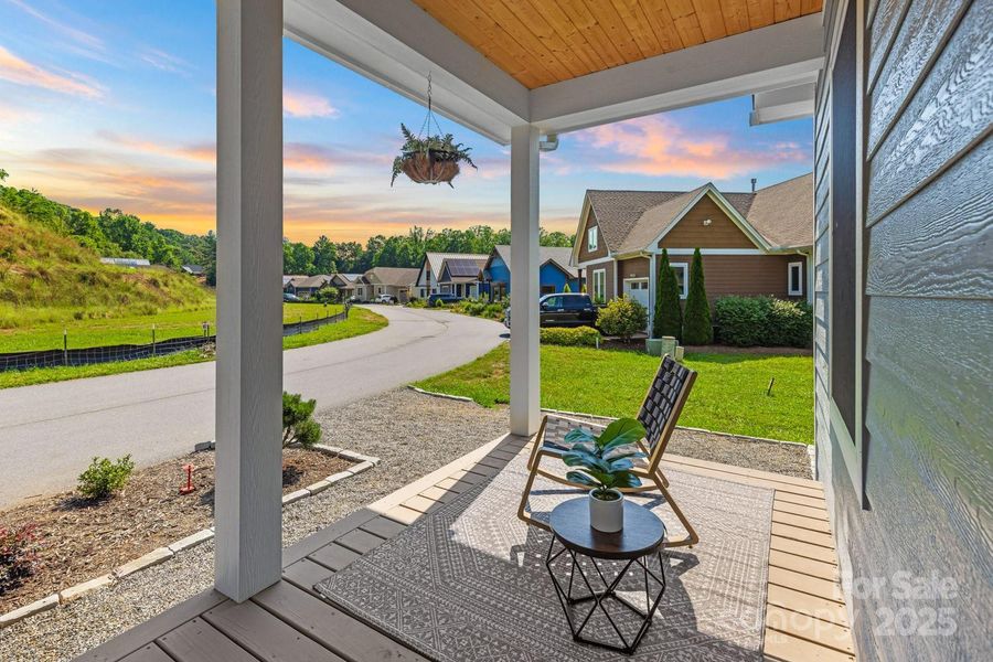 Greet neighbors from the expansive front porch.