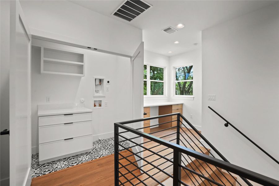 A clever blend of utility and workspace, with abundant natural light.