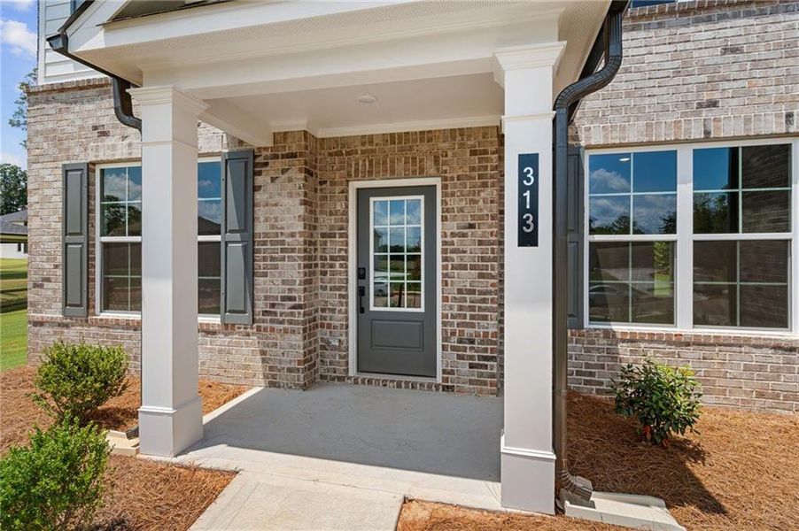 Exterior details and patio area of a home in Windsong Estates, McDonough (Image 20).