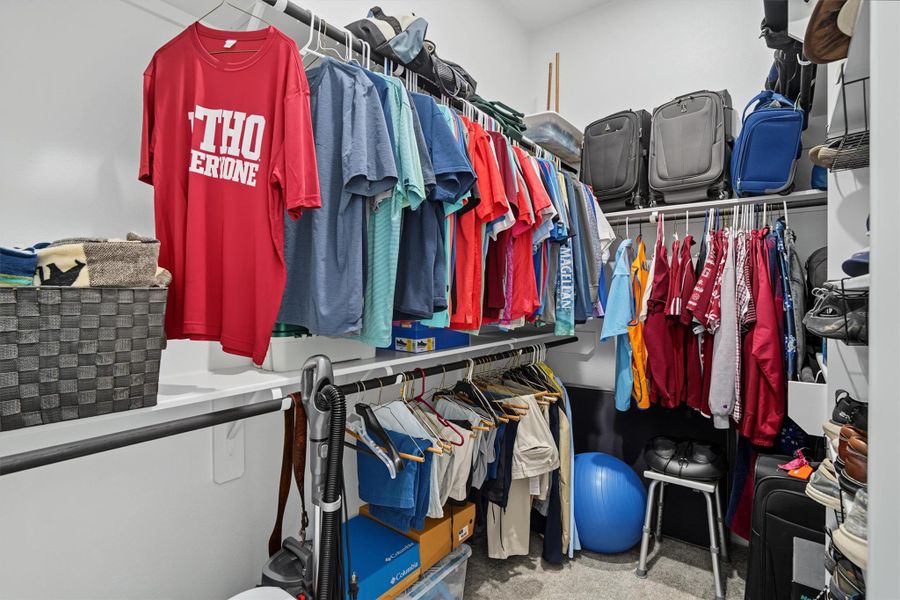 One of two walk in closets in the primary en suite One of two walk in closets in the primary en suite