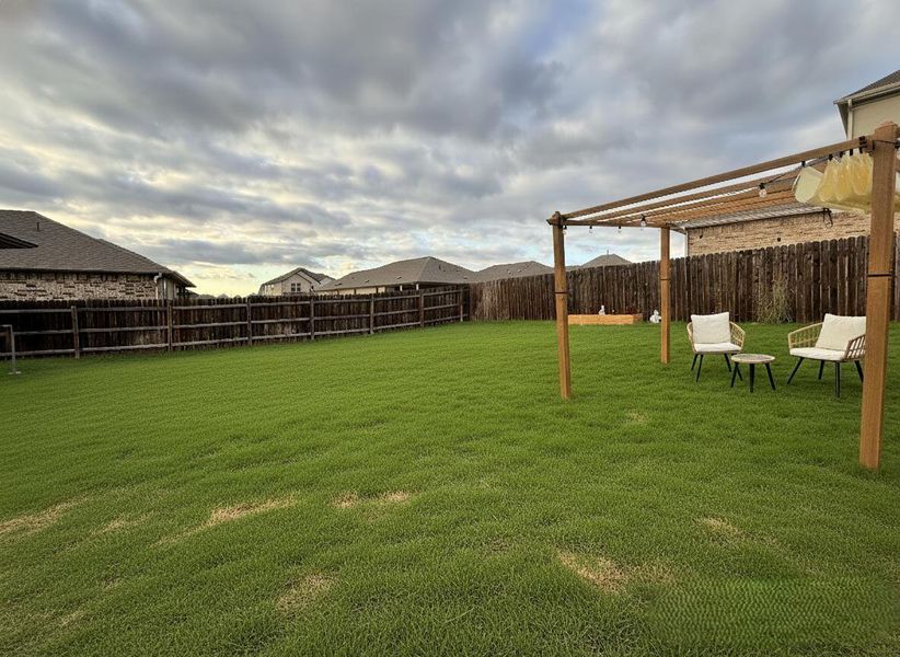 View of fenced backyard