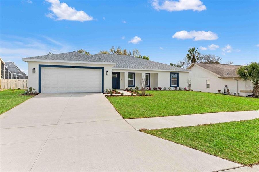 Front exterior of a new home in , Spring Hill, FL, highlighting curb appeal (Image 1). Front exterior of a new home in , Spring Hill, FL, highlighting curb appeal (Image 1).
