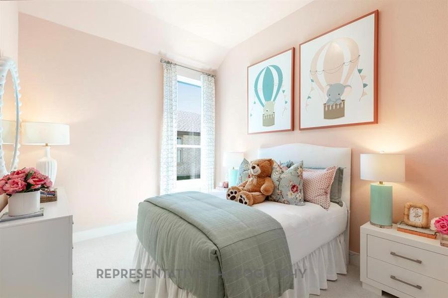 Bedroom with light colored carpet and lofted ceiling