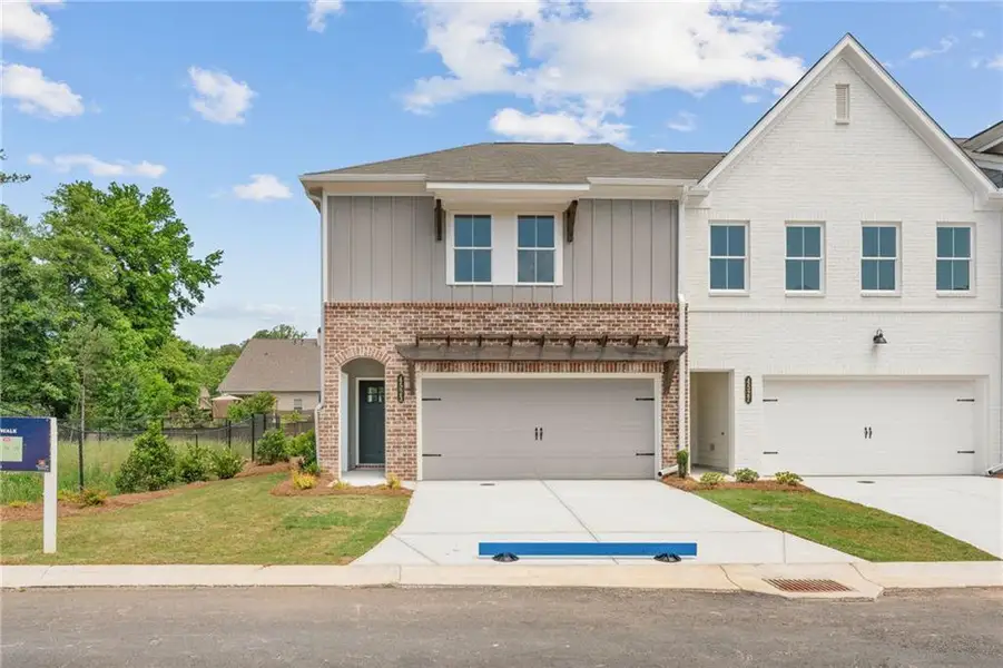 Front exterior of a new home in Wilkins Walk, Mableton, GA, highlighting curb appeal (Image 1). Front exterior of a new home in Wilkins Walk, Mableton, GA, highlighting curb appeal (Image 1).