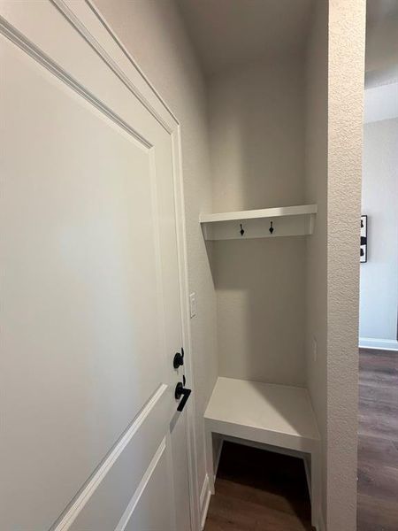 Mudroom featuring dark wood-style floors
