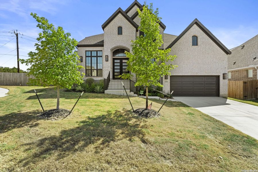 Front exterior of a new home in Kallison Ranch, San Antonio, TX, highlighting curb appeal (Image 20).