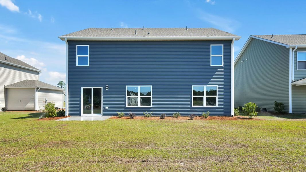 Exterior details and patio area of a home in Cedar Hill Landing, Navassa (Image 2). Exterior details and patio area of a home in Cedar Hill Landing, Navassa (Image 2).