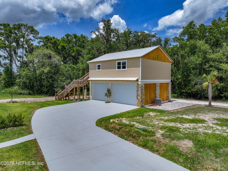 Front exterior of a new home in , East Palatka, FL, highlighting curb appeal (Image 50). Front exterior of a new home in , East Palatka, FL, highlighting curb appeal (Image 50).