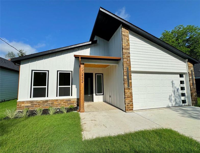 Front exterior of a new home in , Greenville, TX, highlighting curb appeal (Image 9).