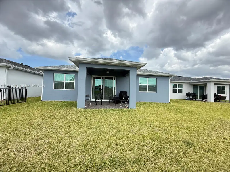 Exterior details and patio area of a home in Tradition, Port St. Lucie (Image 27).