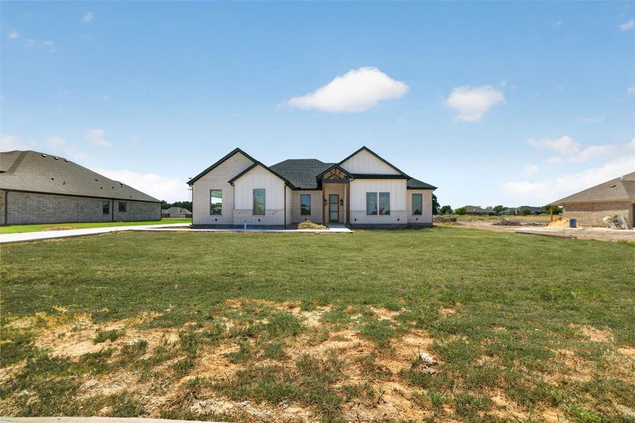 Front exterior of a new home in , Lone Oak, TX, highlighting curb appeal (Image 1). Front exterior of a new home in , Lone Oak, TX, highlighting curb appeal (Image 1).