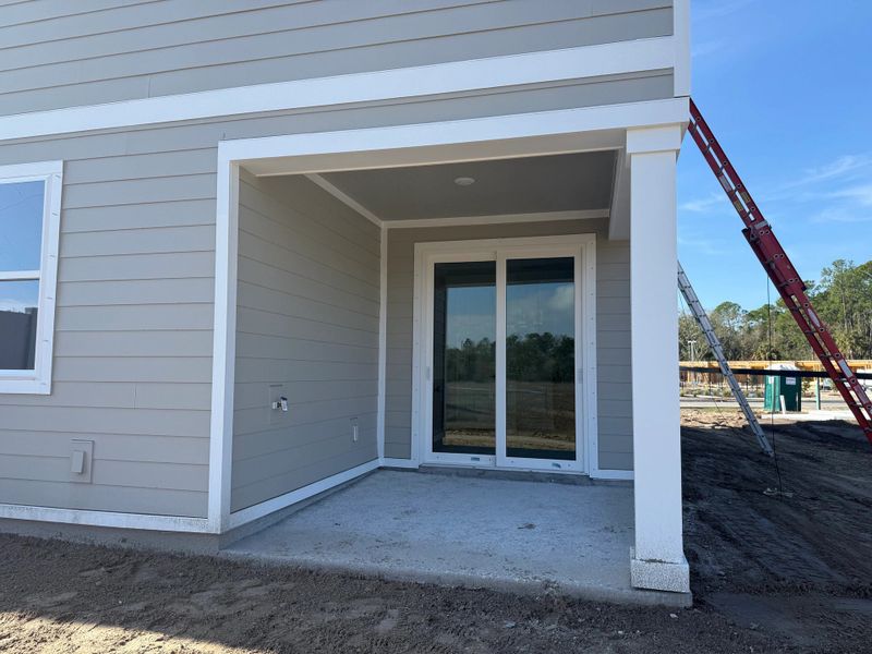 Expansive covered lanai at the back of the home