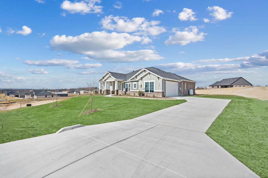 Front exterior of a new home in Rocky Top Ranch, Reno, TX, highlighting curb appeal (Image 27). Front exterior of a new home in Rocky Top Ranch, Reno, TX, highlighting curb appeal (Image 27).
