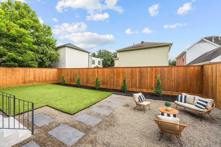 [BACKYARD] A dream backyard designed for every lifestyle, featuring lush green space for play and pets alongside beautifully hardscaped entertaining areas. A perfect setting for gatherings, relaxation and outdoor living.