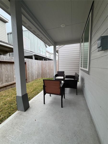 Exterior details and patio area of a home in Dunvale Village - Townhome Collection, Houston (Image 13).