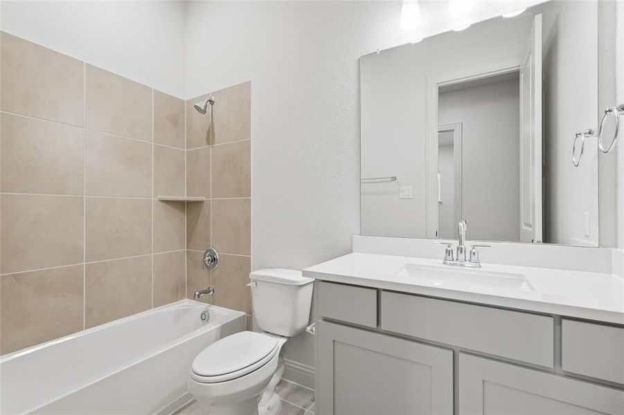 Bathroom with vanity and shower / washtub combination